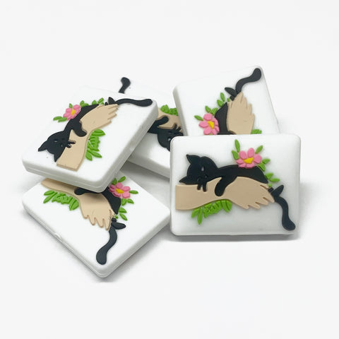 Arm Holding Black Cat Silicone Focal Bead